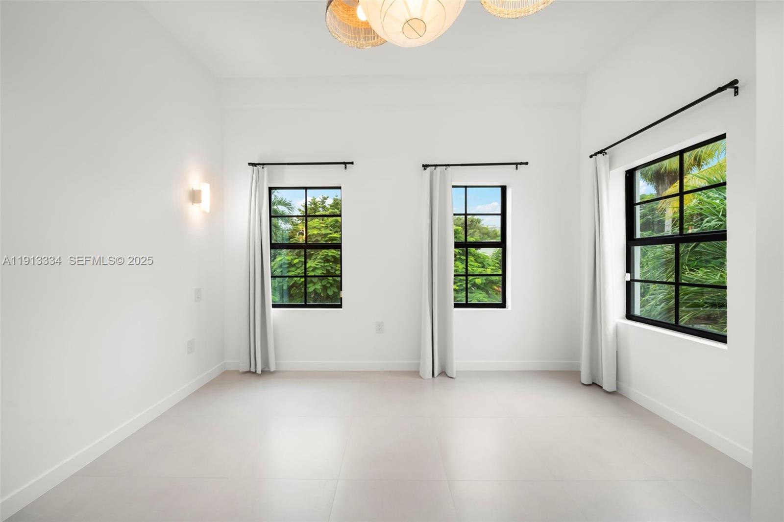 151 Northeast 43rd Street Miami, FL 33137 - Photo 18 of 51 an empty room with windows