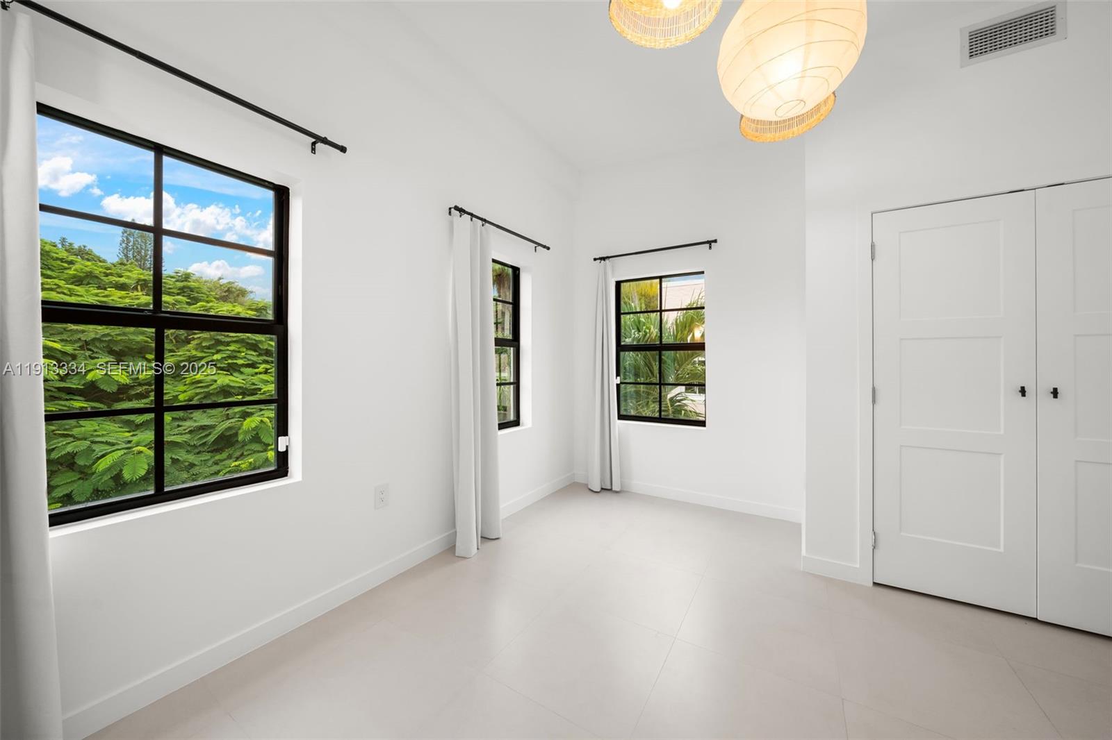 151 Northeast 43rd Street Miami, FL 33137 - Photo 19 of 51 an empty room with windows