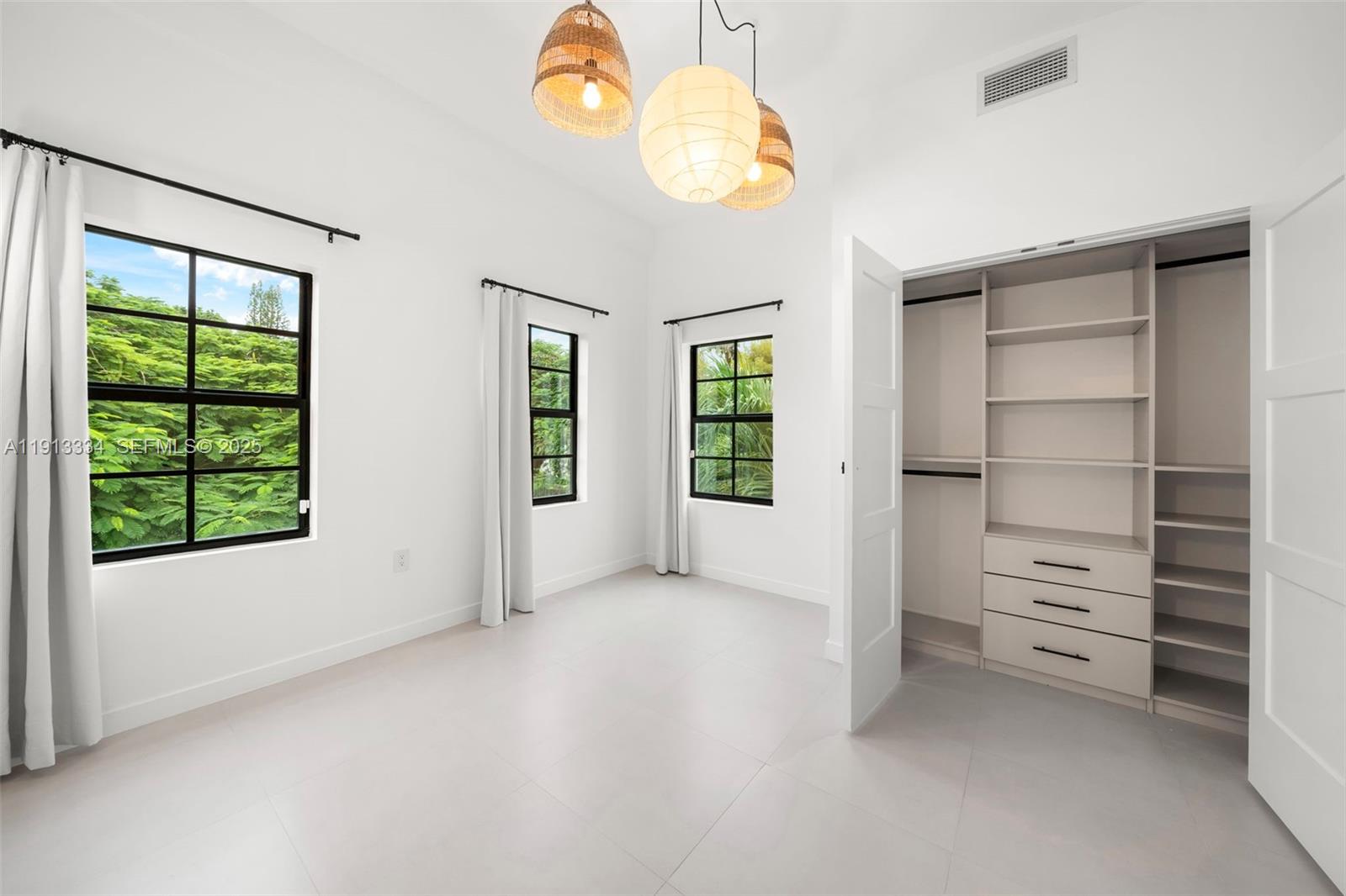 151 Northeast 43rd Street Miami, FL 33137 - Photo 20 of 51 a view of an empty room with a window