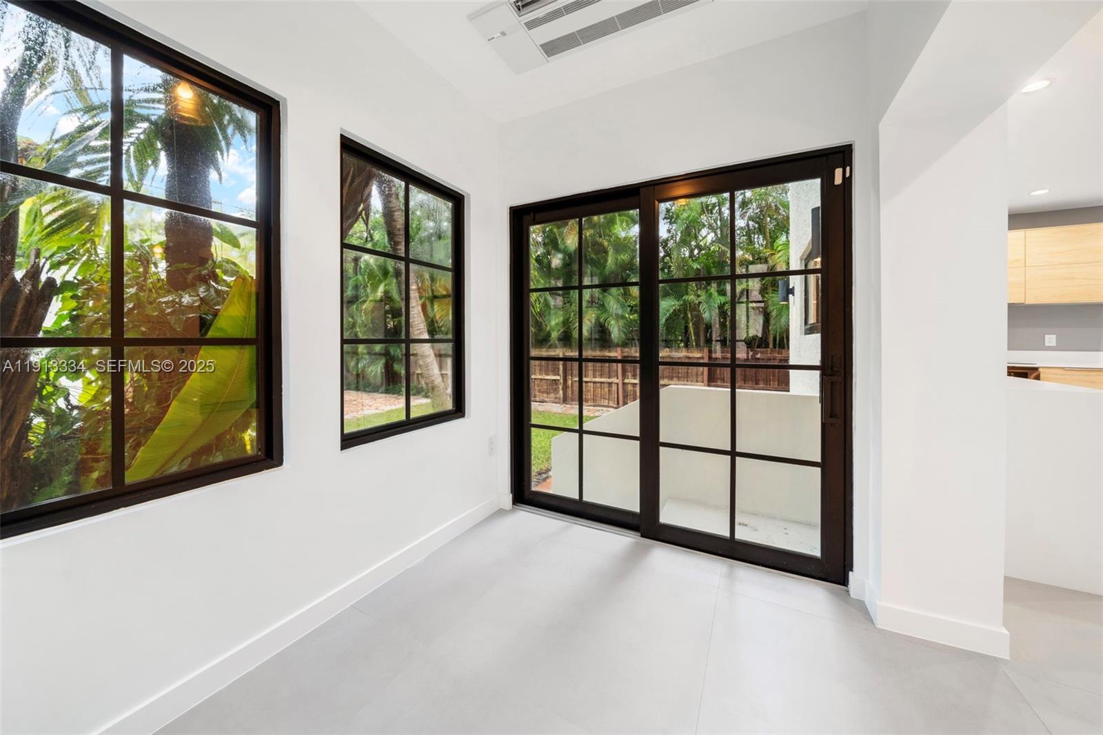 151 Northeast 43rd Street Miami, FL 33137 - Photo 34 of 51 a view of a room with large windows