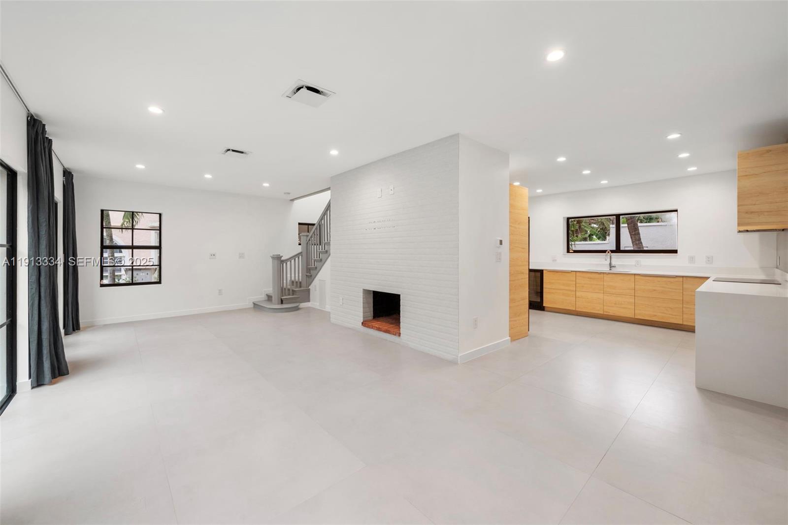 151 Northeast 43rd Street Miami, FL 33137 - Photo 38 of 51 a view of a big room with closet and windows