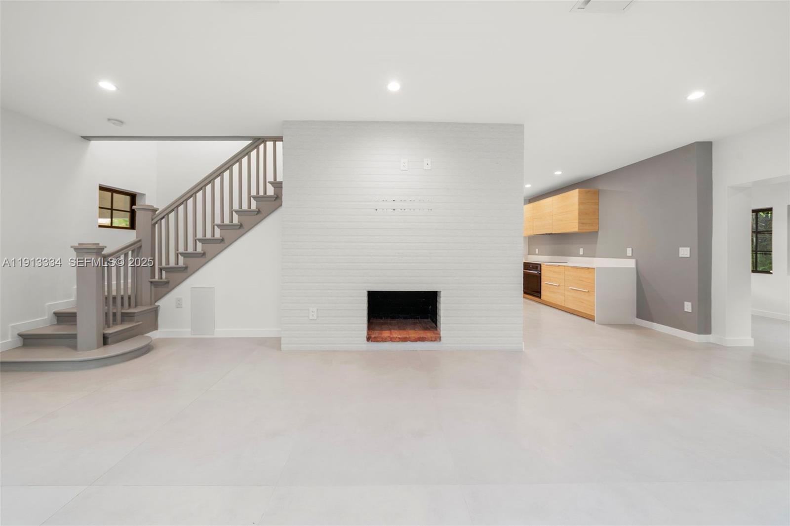 151 Northeast 43rd Street Miami, FL 33137 - Photo 40 of 51 a view of a livingroom with a fireplace
