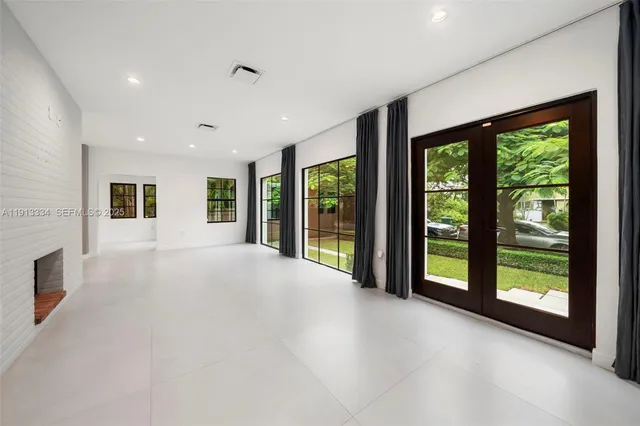 a view of an empty room with windows