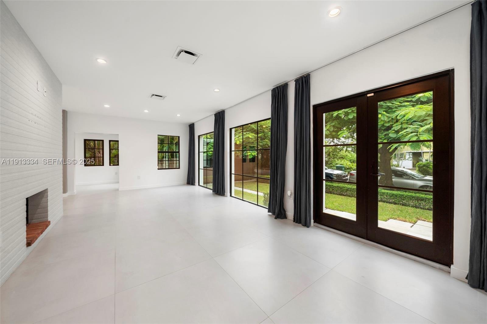 151 Northeast 43rd Street Miami, FL 33137 - Photo 42 of 51 a view of an empty room with windows