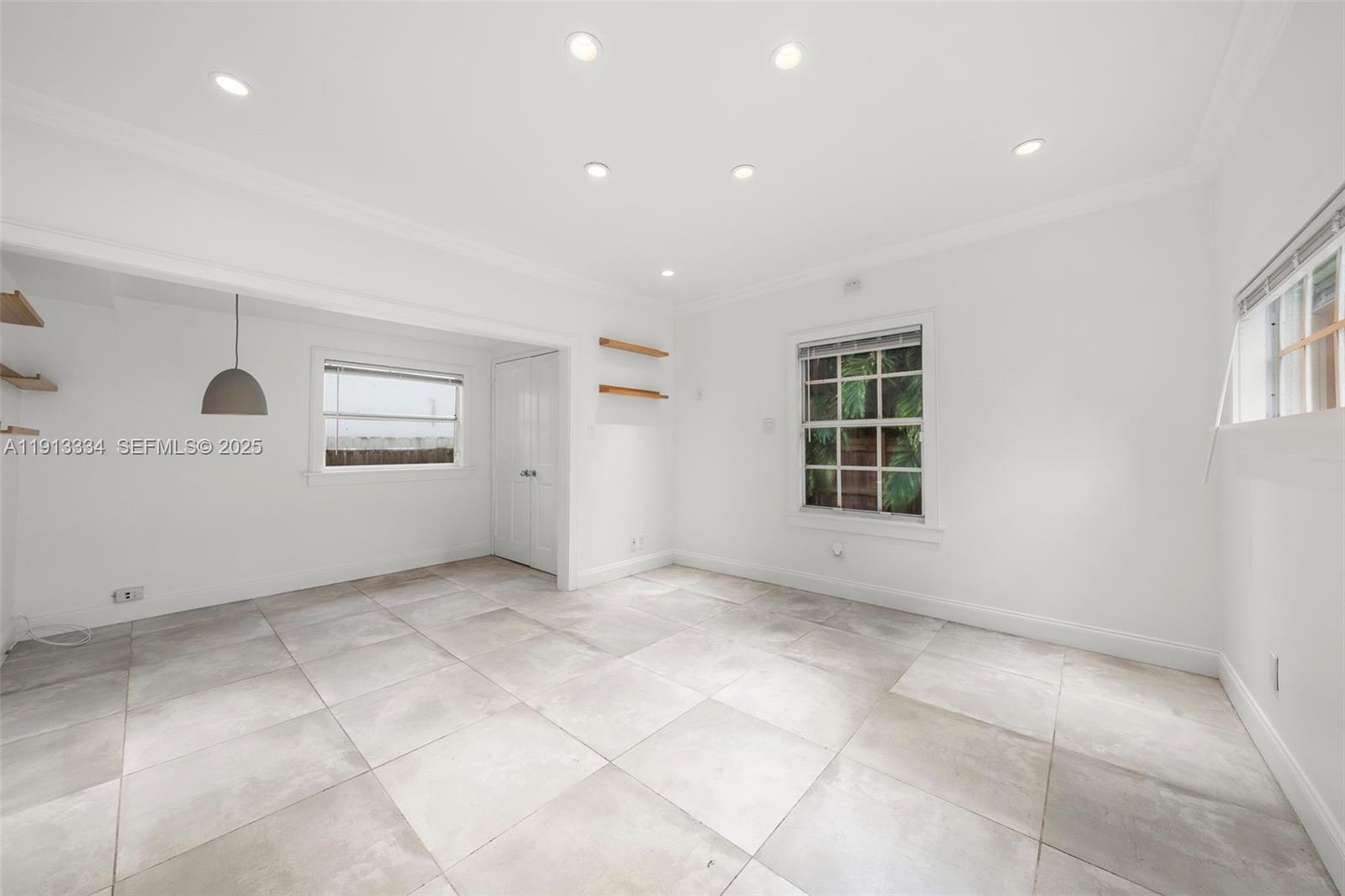 151 Northeast 43rd Street Miami, FL 33137 - Photo 43 of 51 an empty room with windows