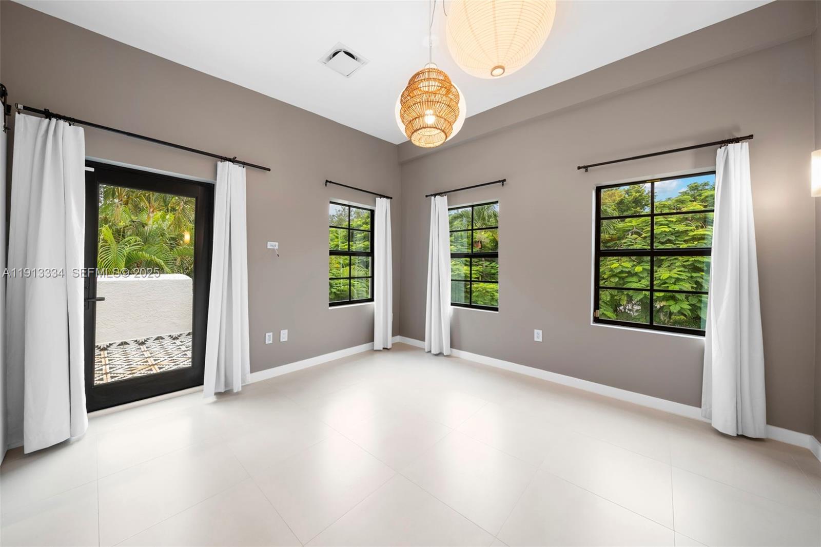 151 Northeast 43rd Street Miami, FL 33137 - Photo 8 of 51 a view of an empty room with a window