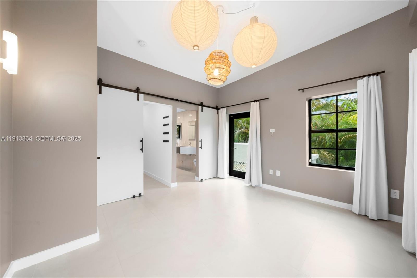 151 Northeast 43rd Street Miami, FL 33137 - Photo 9 of 51 an empty room with windows and closet