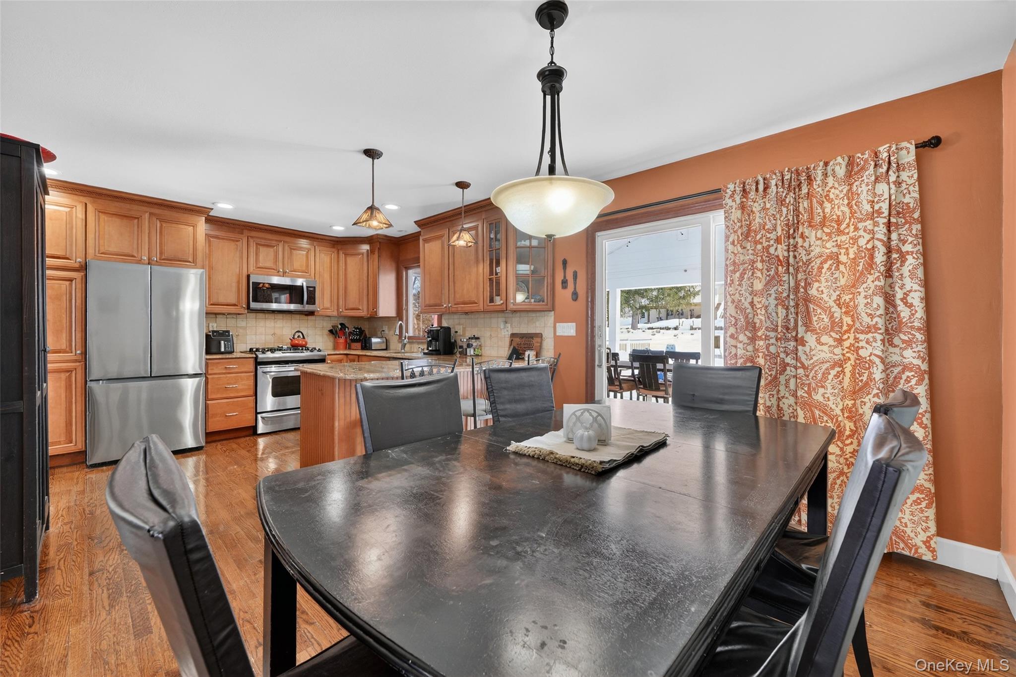 4 Adams Drive Stony Point, NY 10980 - Photo 13 of 41 a kitchen with stainless steel appliances granite countertop a stove refrigerator dining table and chairs
