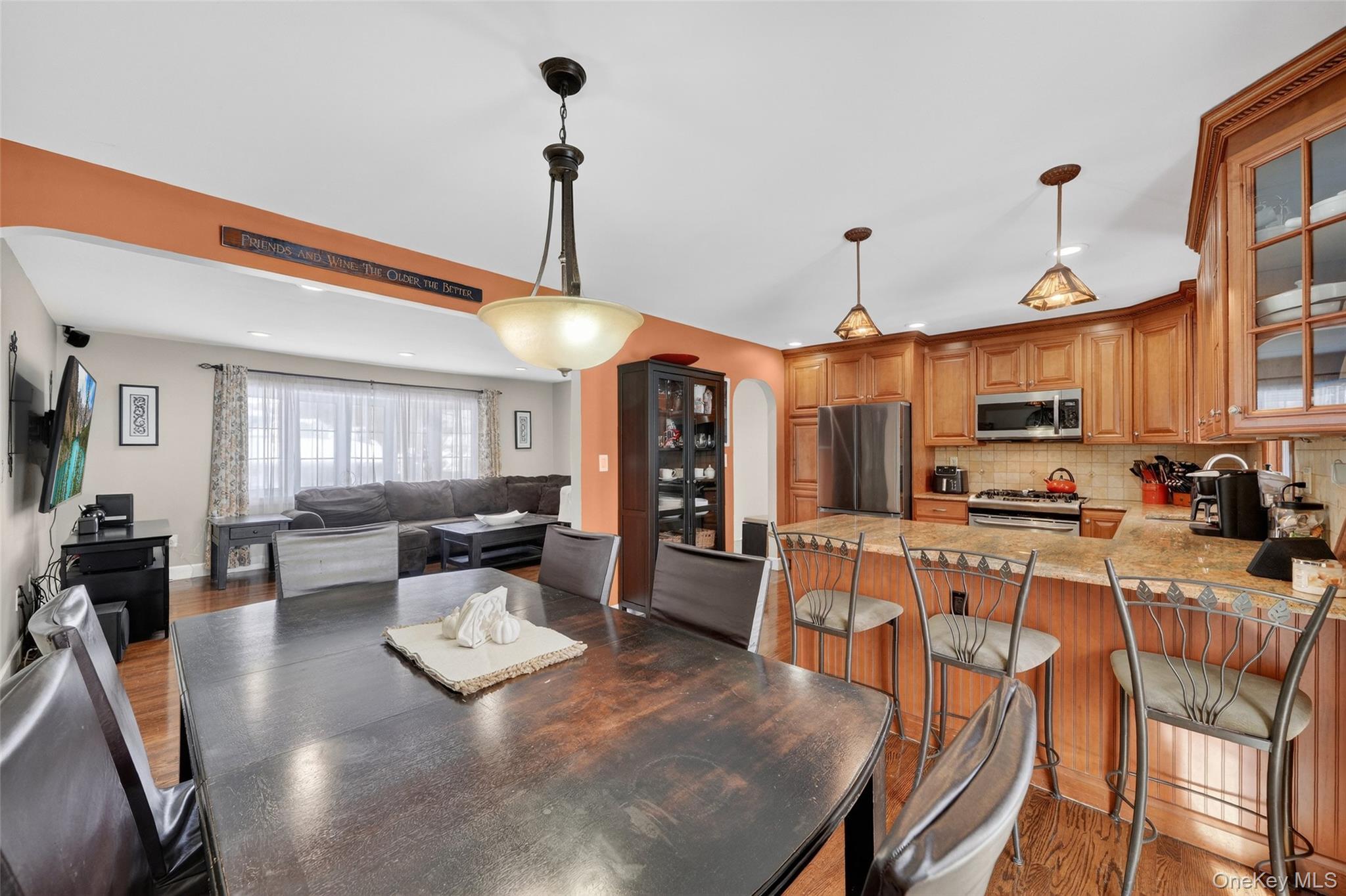4 Adams Drive Stony Point, NY 10980 - Photo 15 of 41 a view of a dining room and livingroom with furniture wooden floor a chandelier