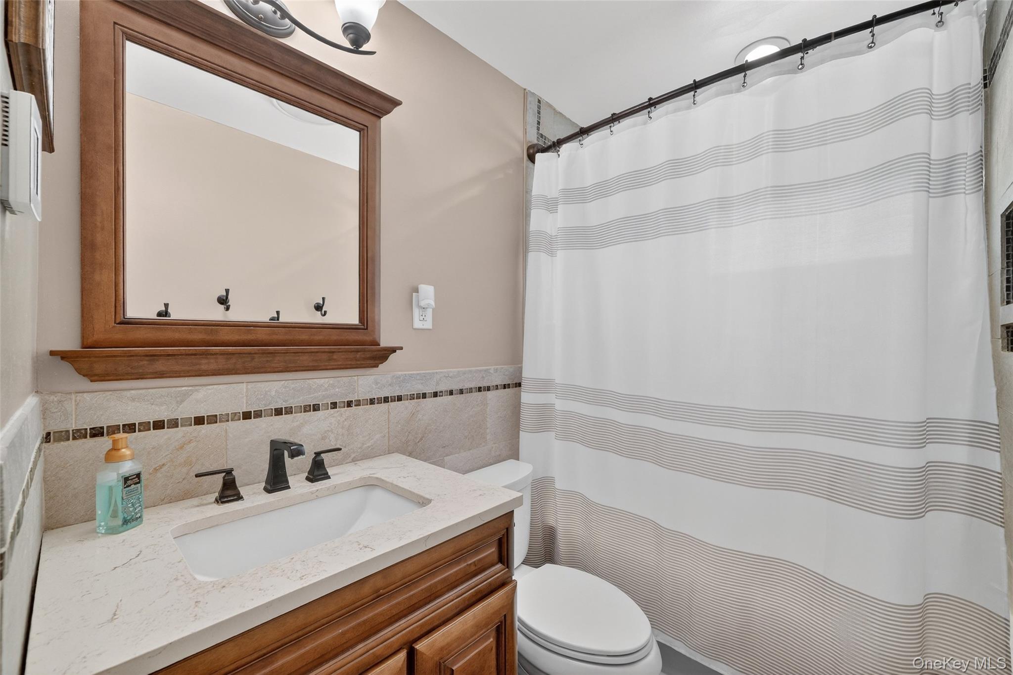 4 Adams Drive Stony Point, NY 10980 - Photo 22 of 41 a bathroom with a sink a toilet and shower