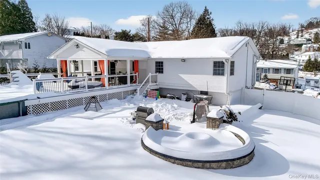 a aerial view of a house with swimming pool and furniture