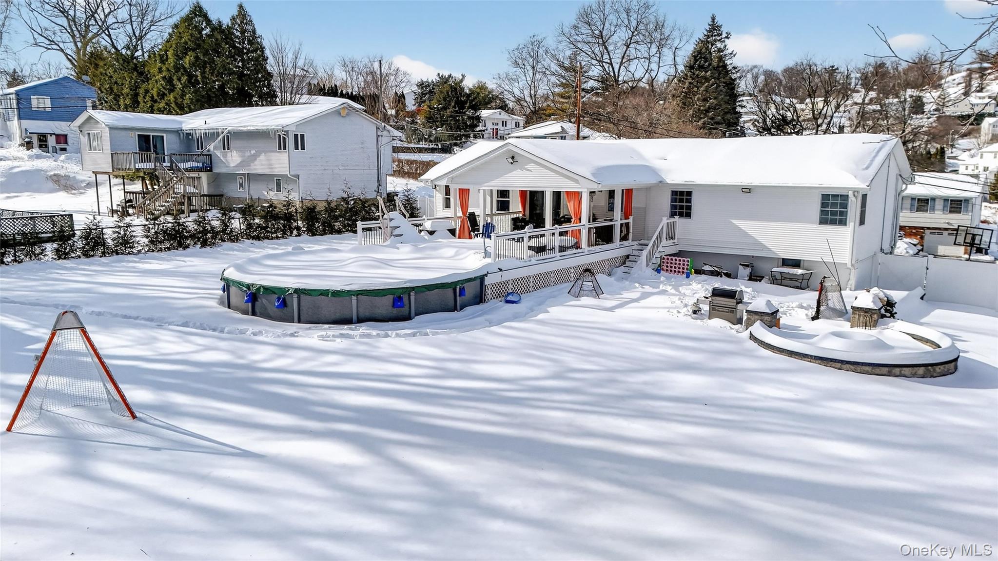 4 Adams Drive Stony Point, NY 10980 - Photo 39 of 41 a view of a white house with swimming pool table and chairs