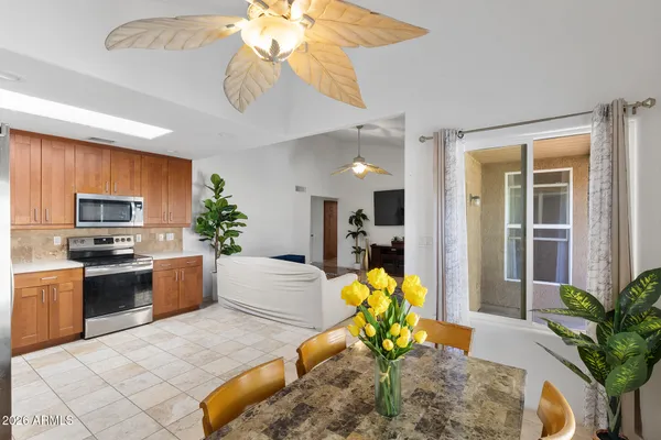 a kitchen with granite countertop stainless steel appliances cabinets and a sink