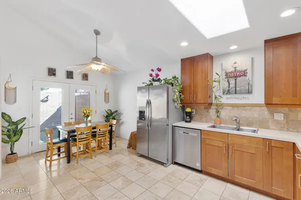 a kitchen with a sink a stove and cabinets