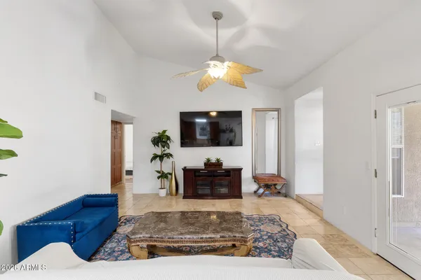 a living room with furniture and a rug