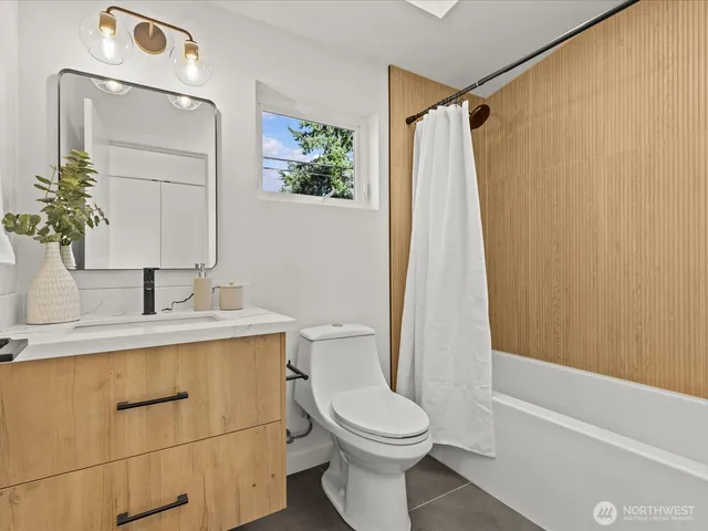 a bathroom with a bathtub sink and toilet
