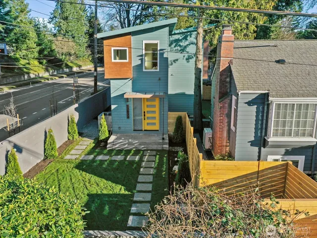 an aerial view of residential house with outdoor space and street view