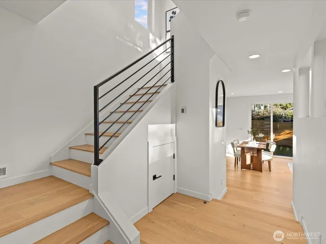 a large kitchen with a table and chairs