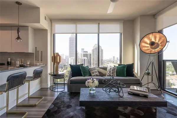 a living room with furniture and a large window