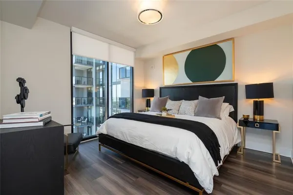 a bedroom with a bed and window