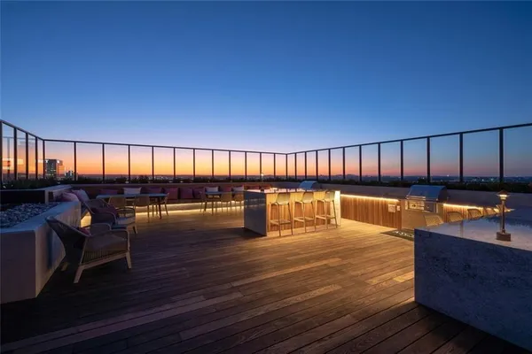 a swimming pool with outdoor seating