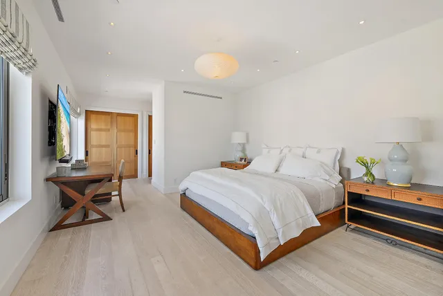 a bedroom with a bed and a windows