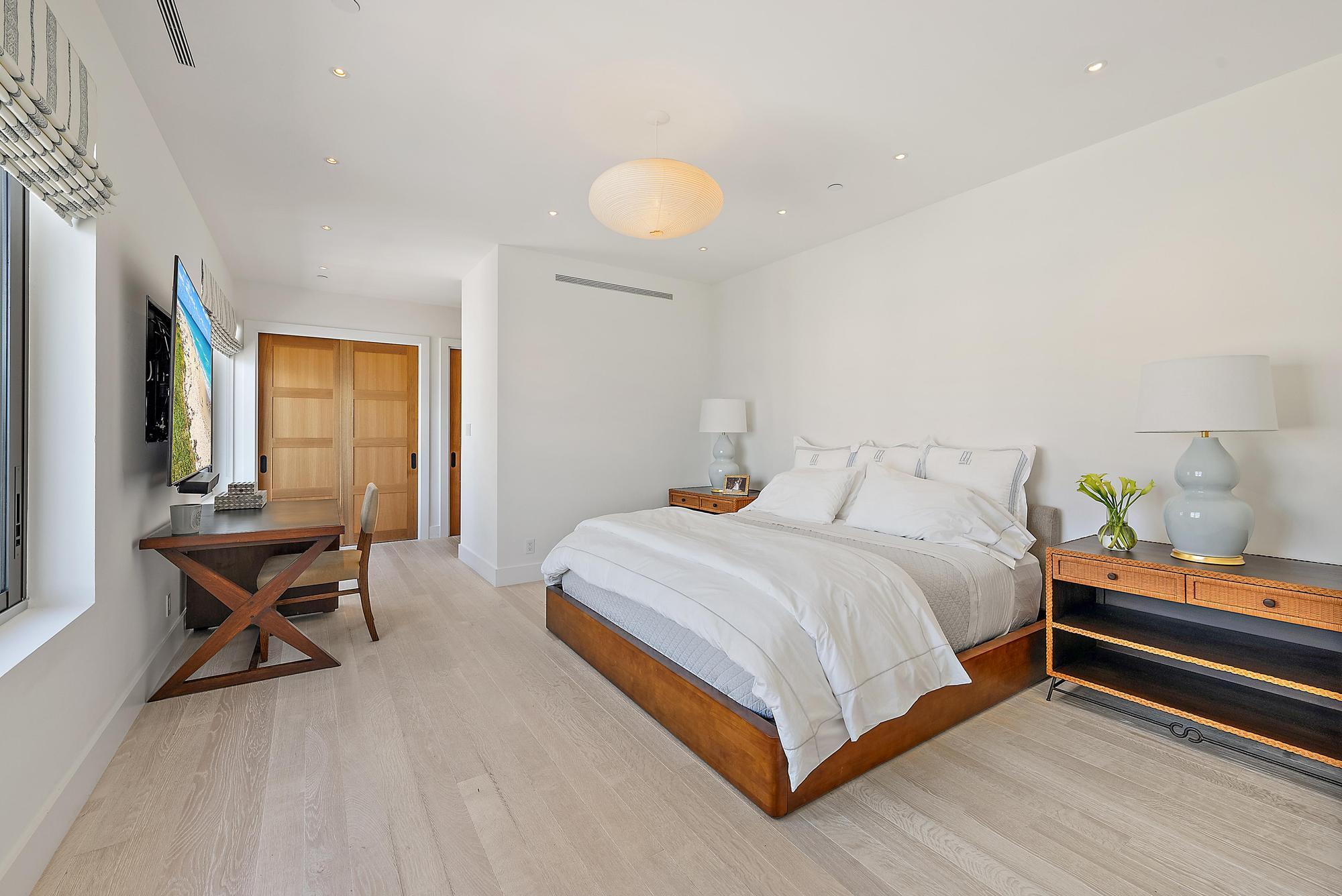 150 Bradley Place, Unit 712 Palm Beach, FL 33480 - Photo 16 of 44 a bedroom with a bed and a windows