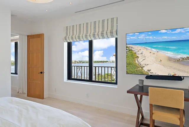 a view of a room with furniture and window