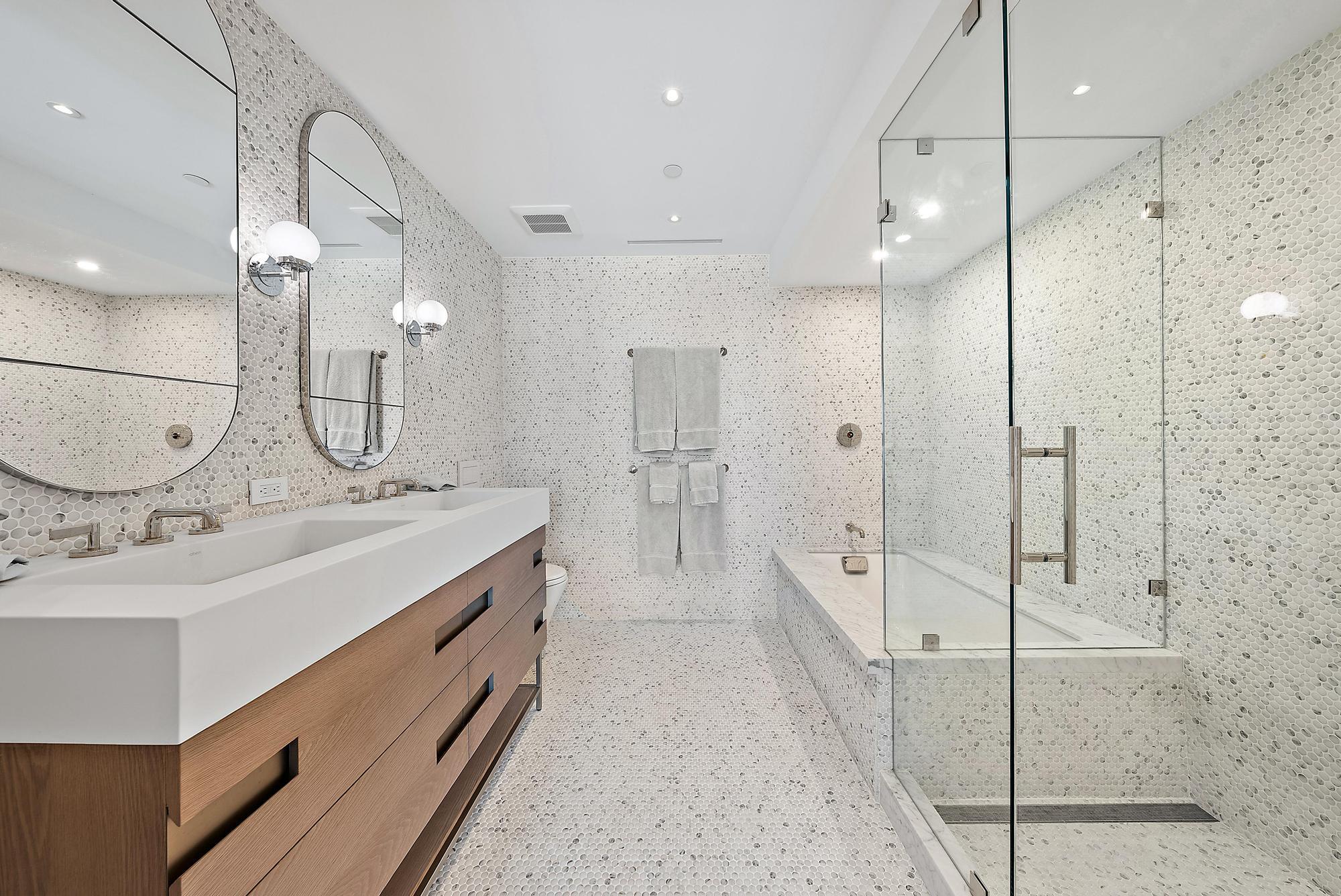 150 Bradley Place, Unit 712 Palm Beach, FL 33480 - Photo 19 of 44 a bathroom with a double vanity sink mirror and shower