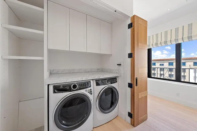 a living room with furniture and flowers