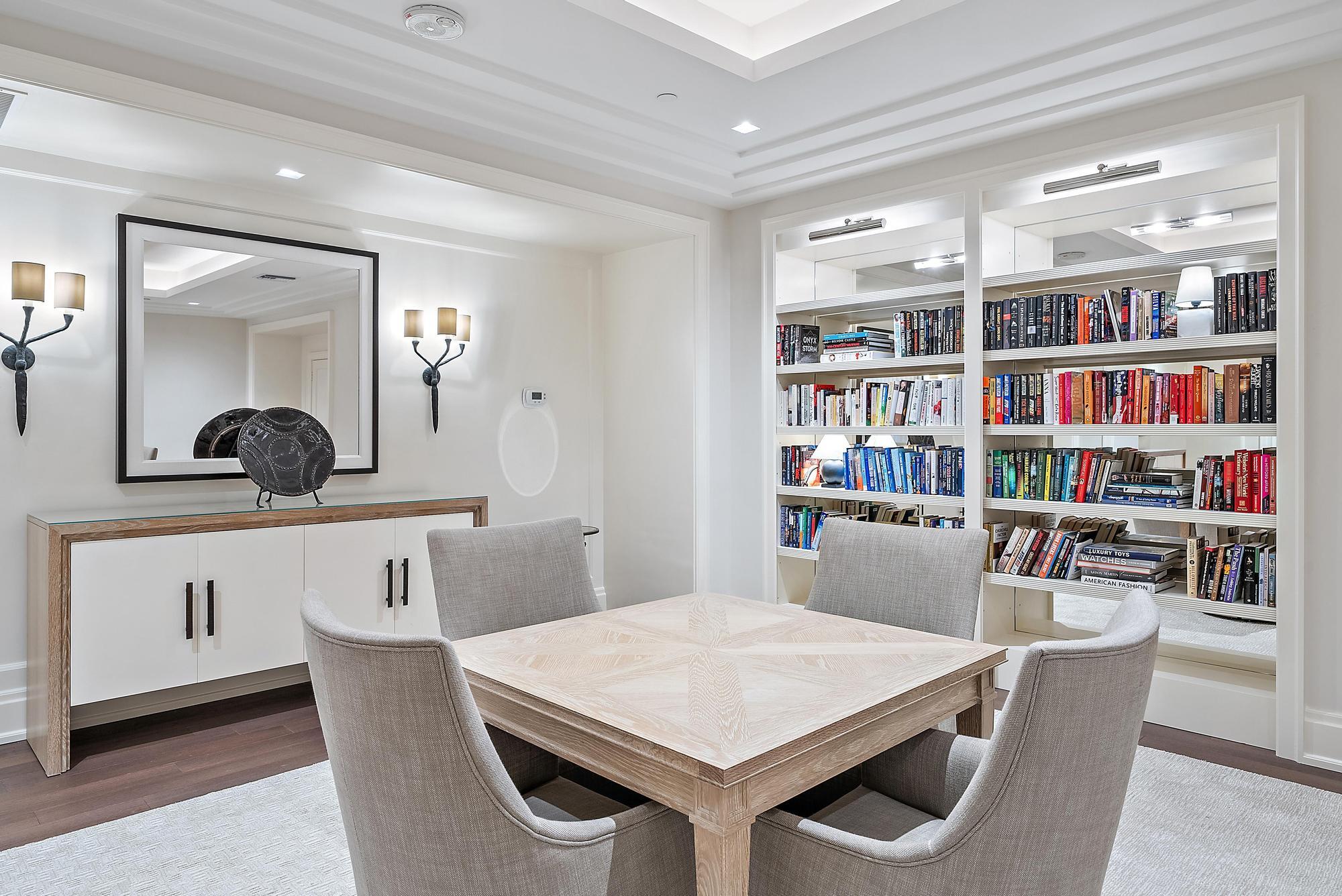 150 Bradley Place, Unit 712 Palm Beach, FL 33480 - Photo 28 of 44 a view of a dining room with furniture and wooden floor