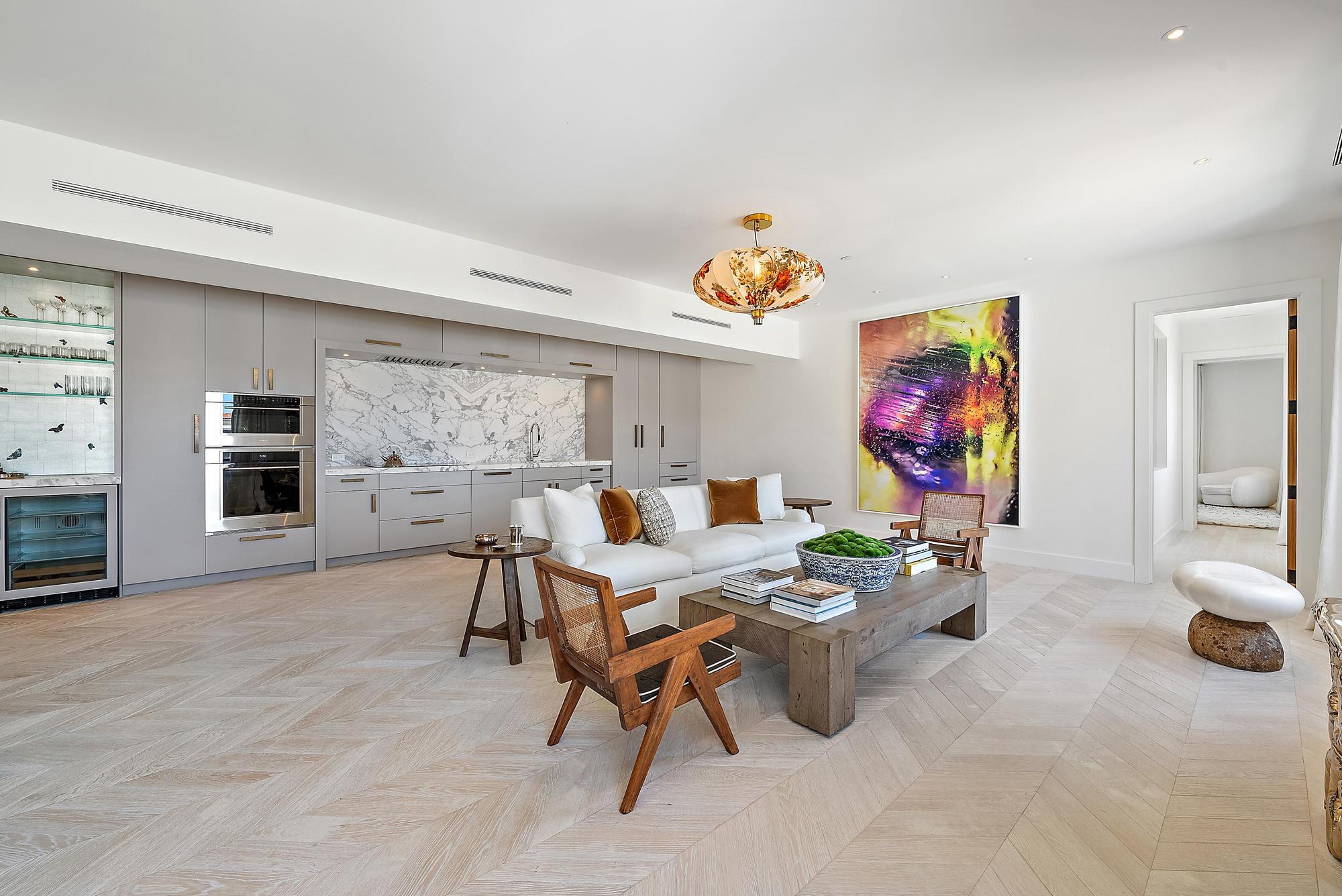 150 Bradley Place, Unit 712 Palm Beach, FL 33480 - Photo 4 of 44 a living room with furniture and a flat screen tv