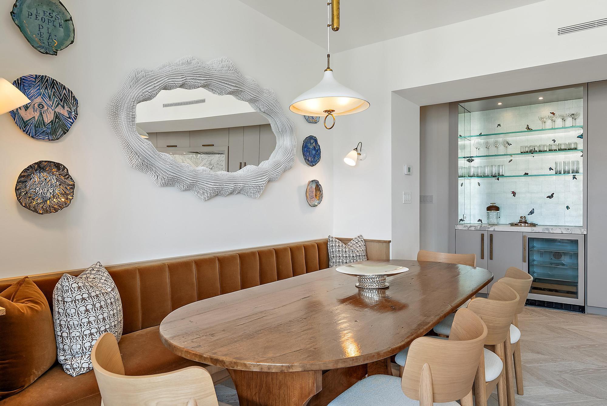 150 Bradley Place, Unit 712 Palm Beach, FL 33480 - Photo 6 of 44 a dining room with furniture a window and wooden floor