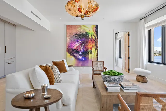 a living room with furniture and flowers