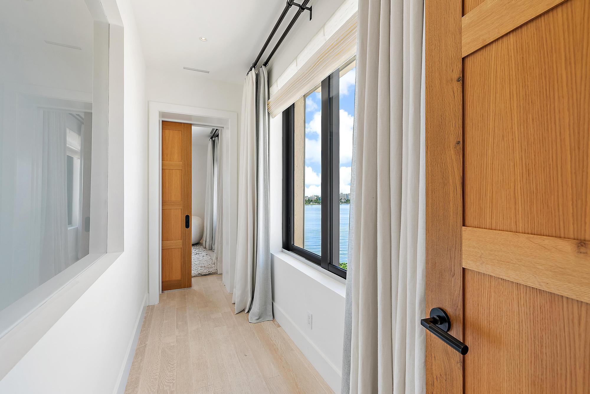 150 Bradley Place, Unit 712 Palm Beach, FL 33480 - Photo 9 of 44 a view of a bathroom with a glass door