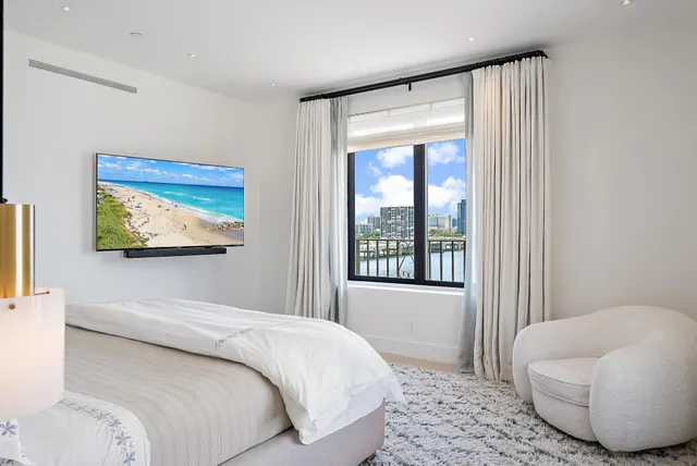 a bedroom with a bed and a couch