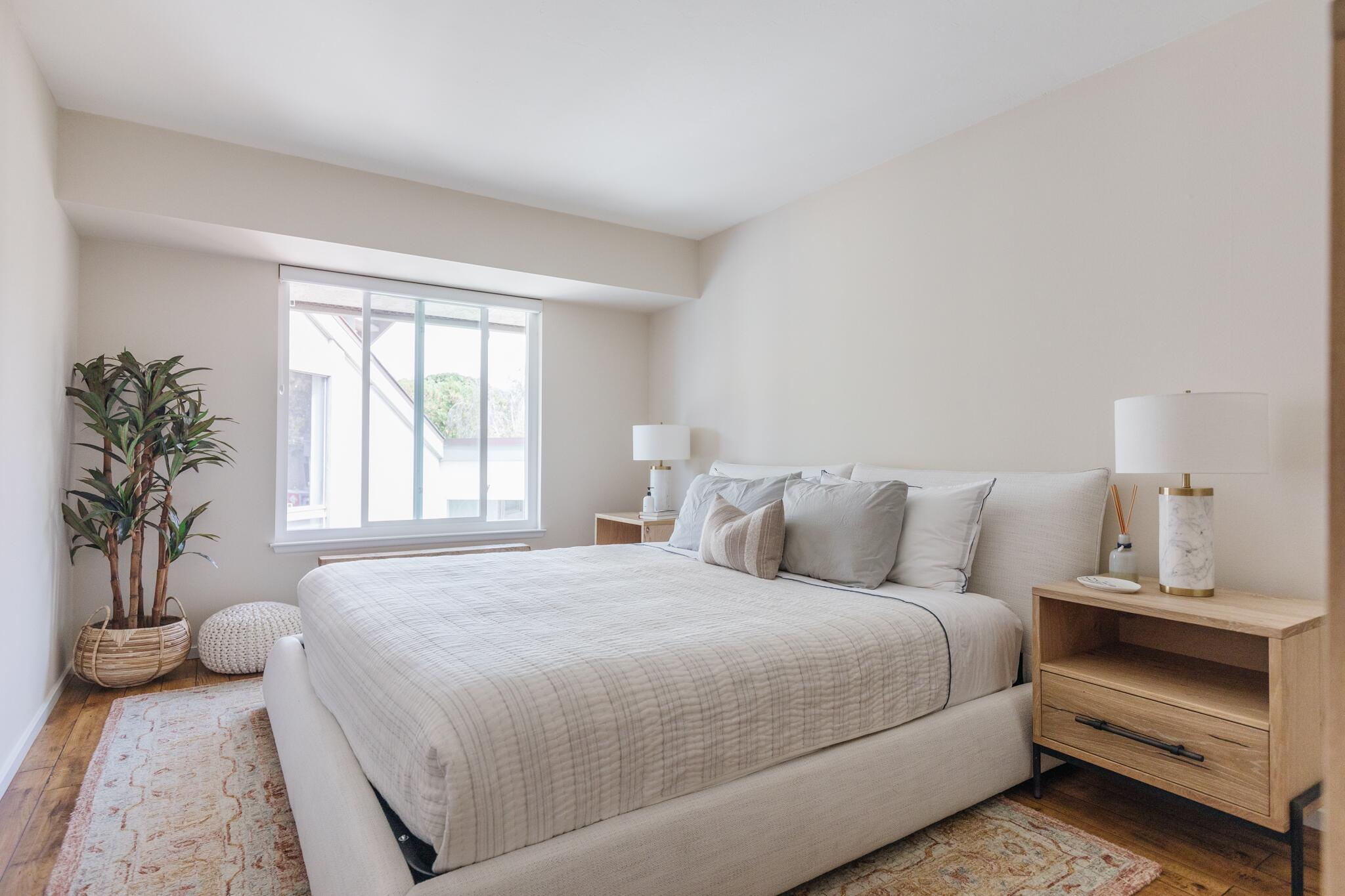 5455 8th Street, Unit 96 Carpinteria, CA 93013 - Photo 18 of 28 a bedroom with a bed and a potted plant