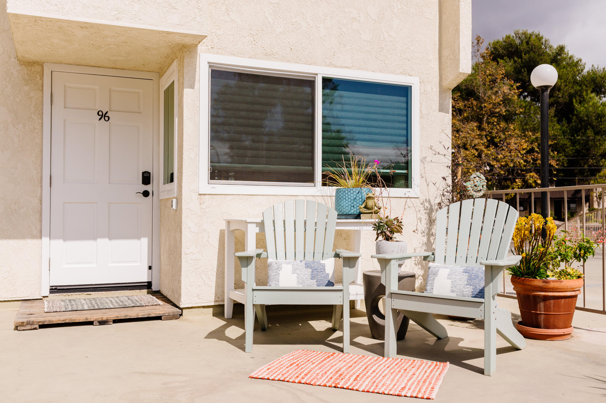 5455 8th Street, Unit 96 Carpinteria, CA 93013 - Photo 2 of 28 a view of balcony with chairs and potted plant