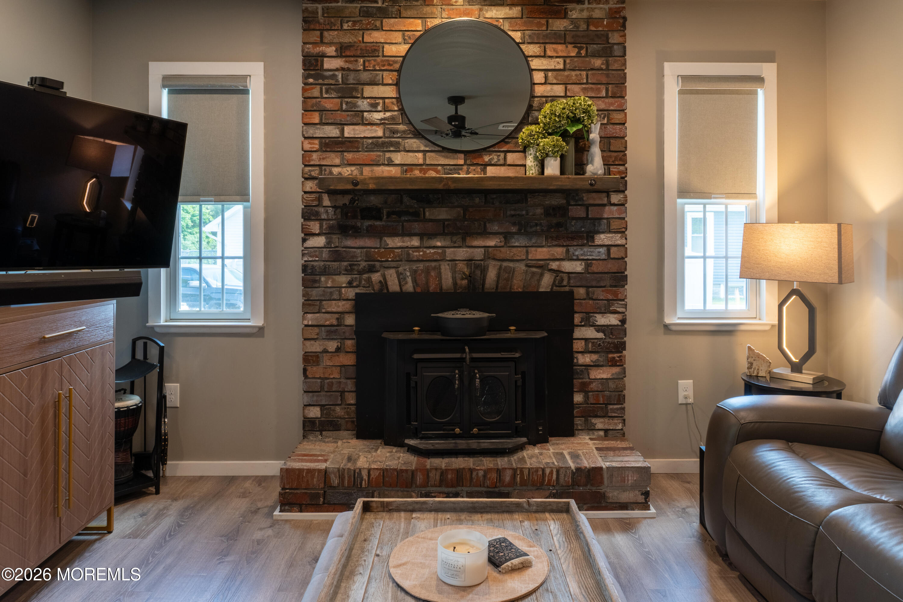 55 Toms River Road Jackson, NJ 08527 - Photo 14 of 31 a living room with furniture and a fireplace