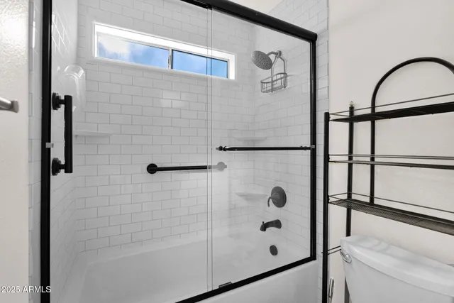 a view of a porch with chairs and a yard