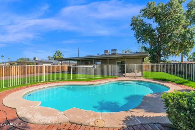 a utility room with sink dryer and washer