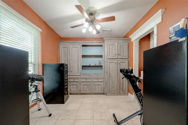 a kitchen with a refrigerator and a refrigerator