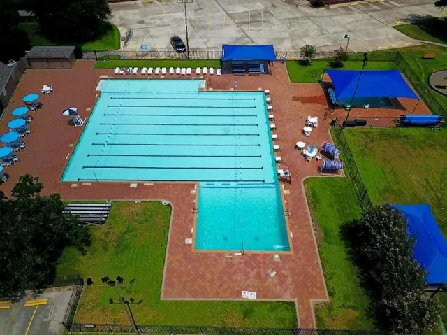 a view of a house with swimming pool and porch with furniture