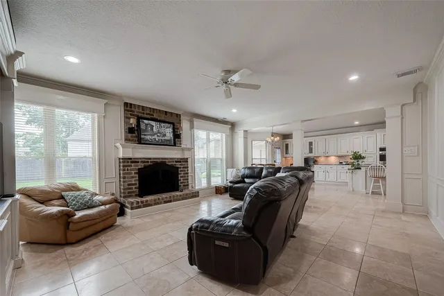 a living room with furniture and a fireplace