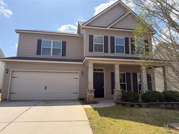 a view of house with yard