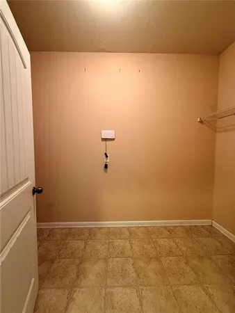 a white toilet sitting in a bathroom