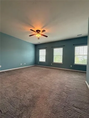 a white bath tub sitting next to a window