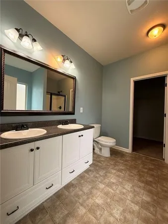 a view of a livingroom with wooden floor and a window