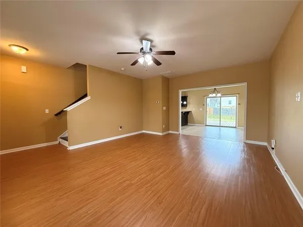 a large kitchen with granite countertop a stove top oven