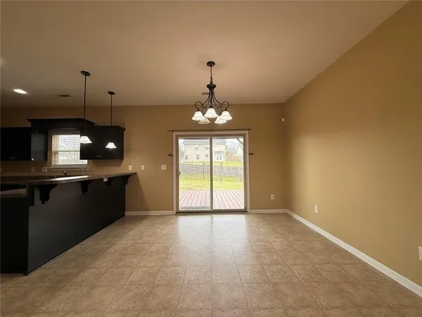 a view of a kitchen with a sink and cabinets